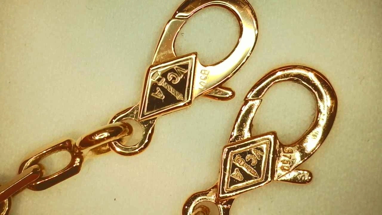 Van Cleef & Arpels clasp construction compared, genuine on the left and counterfeit on the right