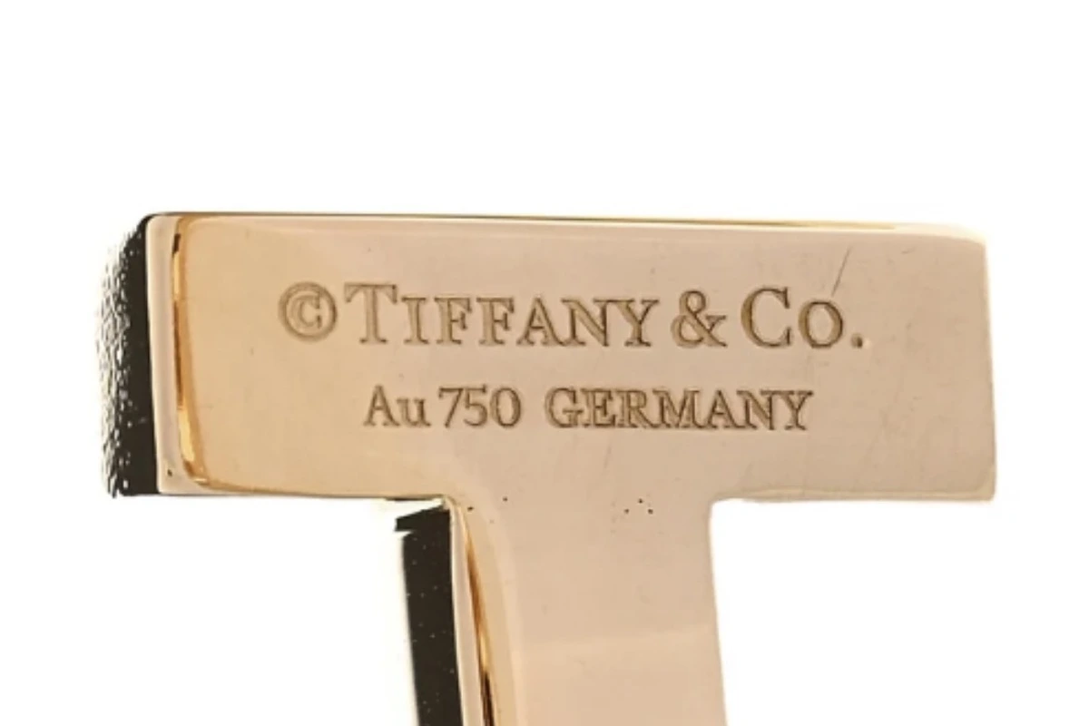 Genuine Tiffany hallmark stamp reading "TIFFANY & CO. Au 750 GERMANY"