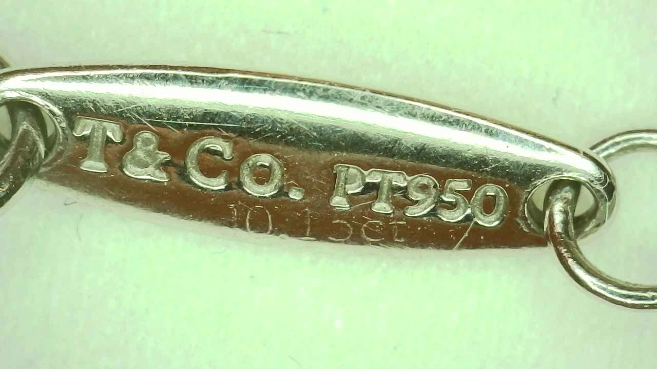 Genuine Tiffany carat-weight engraving reading "T & Co. PT950"