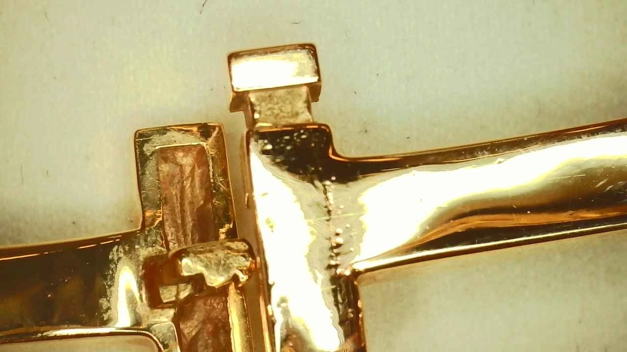 Counterfeit Tiffany T1 bangle clasp showing shoddy finishing