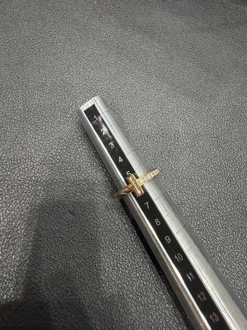 Tiffany T1 ring measured on a ring-sizer stick at size 3.75