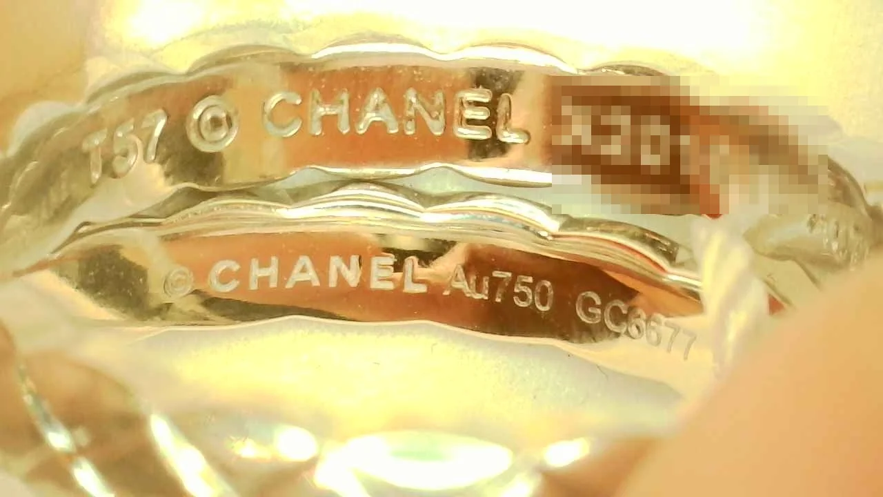 Macro photo of a genuine Chanel Coco Crush Mini ring hallmark engraving