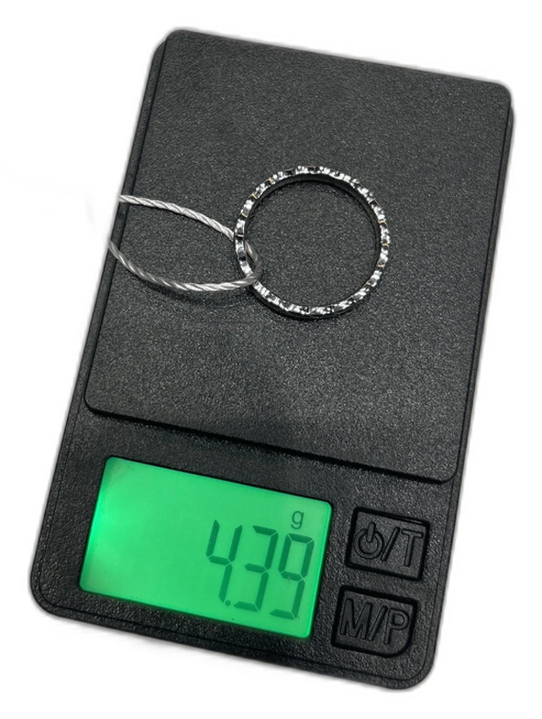 Genuine Chanel Coco Crush Mini ring on a jeweler's scale reading 4.39g