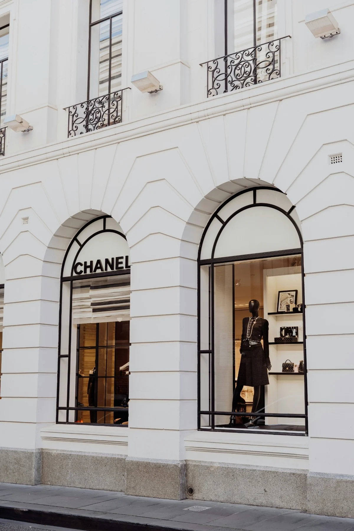 Chanel boutique storefront facade with arched display windows
