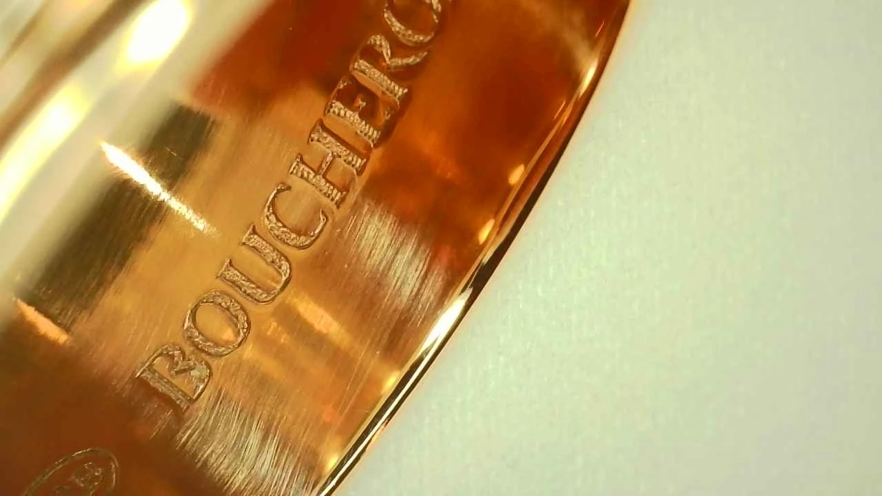Macro photo of a genuine Boucheron Quatre ring hallmark, engraved "BOUCHERON"