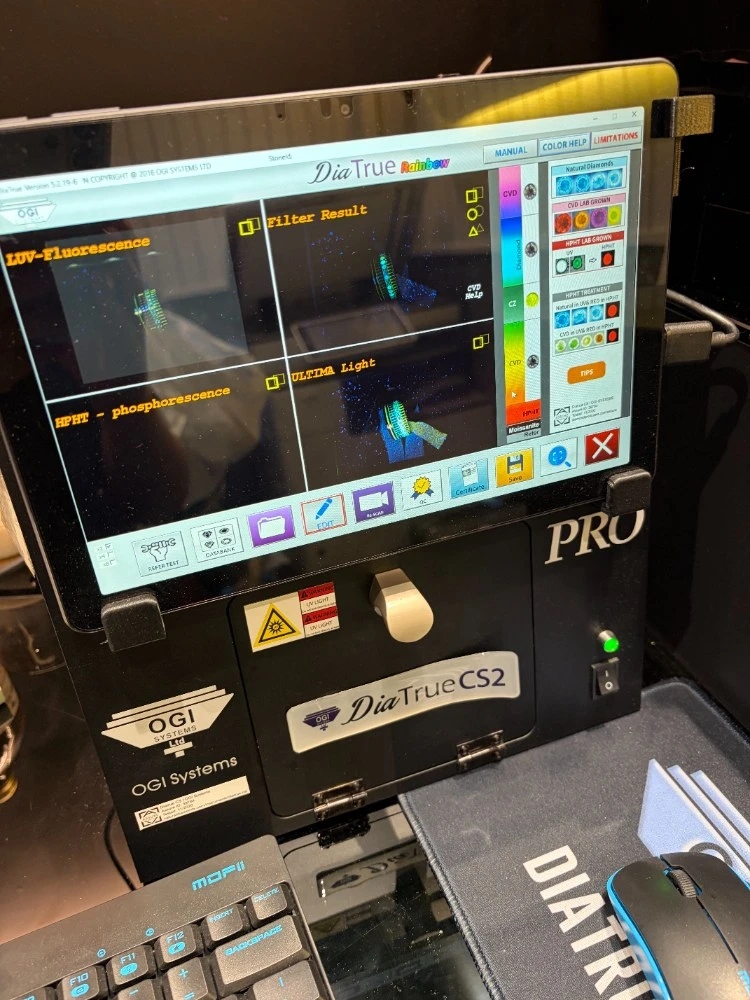 OGI Systems DiaTrue CS2 diamond-screening device showing its full LUV-Fluorescence, Filter Result, HPHT-phosphorescence and ULTIMA Light diagnostic panels