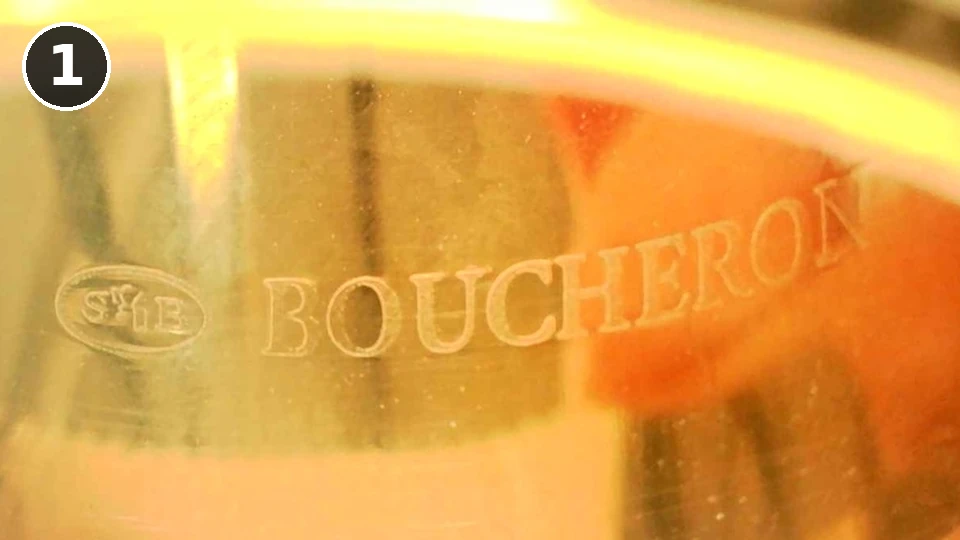 Counterfeit Boucheron Quatre ring, engraving 1: the workshop mark followed by BOUCHERON