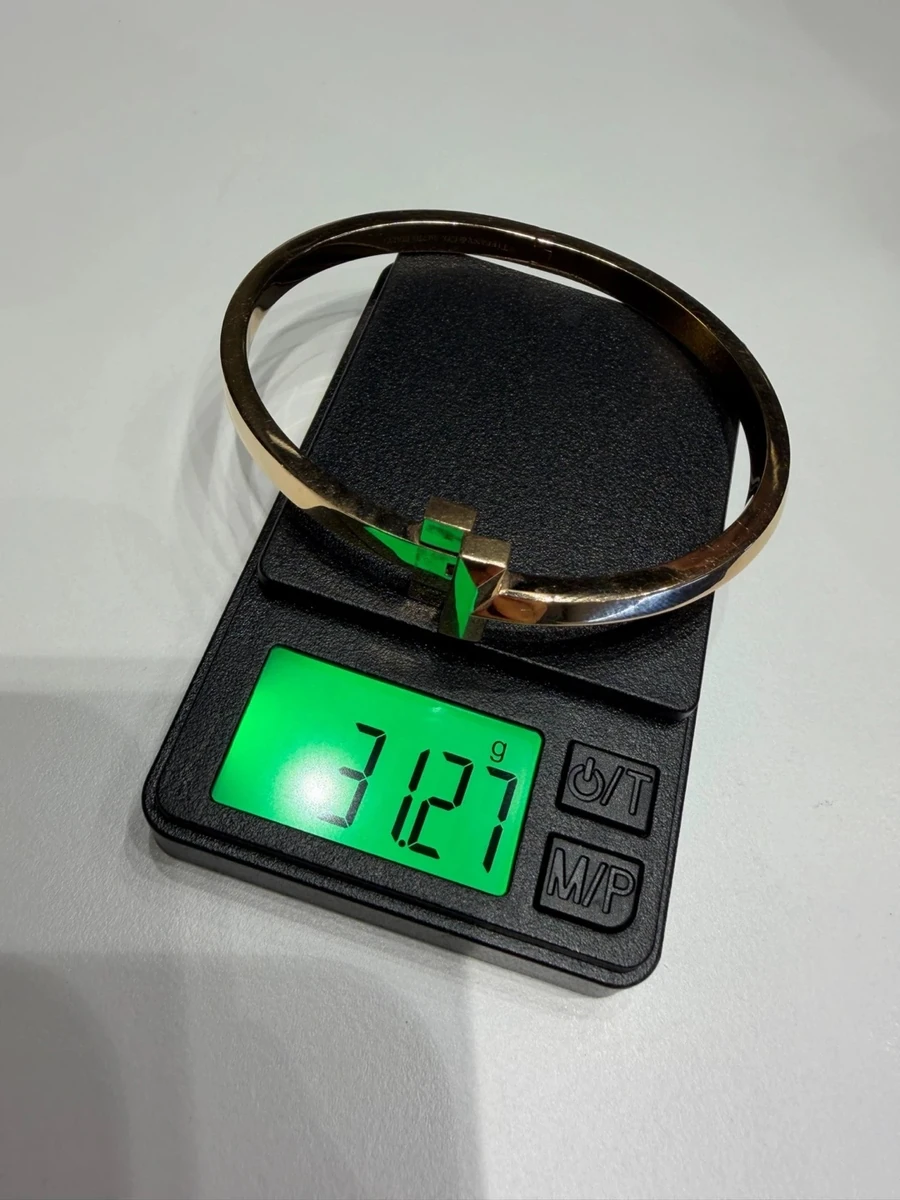 Tiffany T Wide Bangle on a digital scale, reading 31.27 g